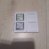 Nintendo DS -pelit valkoisessa säilytyskotelossa